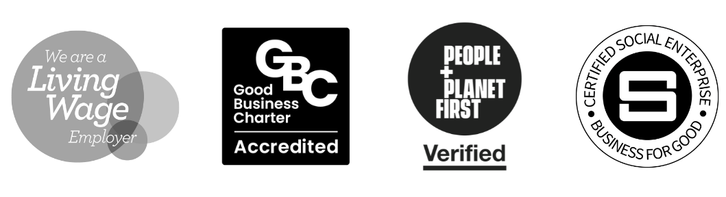 Four monochrome certification badges: Living Wage Employer, Good Business Charter Accredited, People + Planet First Verified, and Certified Social Enterprise.